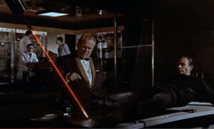 James Bond menaced by a laser in 1964 film Goldfinger