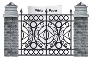 white paper behind a brick and wrought iron gate