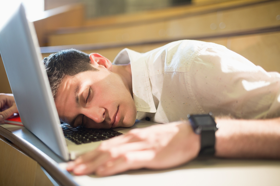 Photo of young business person falling asleep during boring slideshow