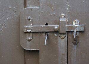 brown gate with rusty latch