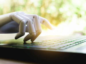 robot fingers typing on keyboard