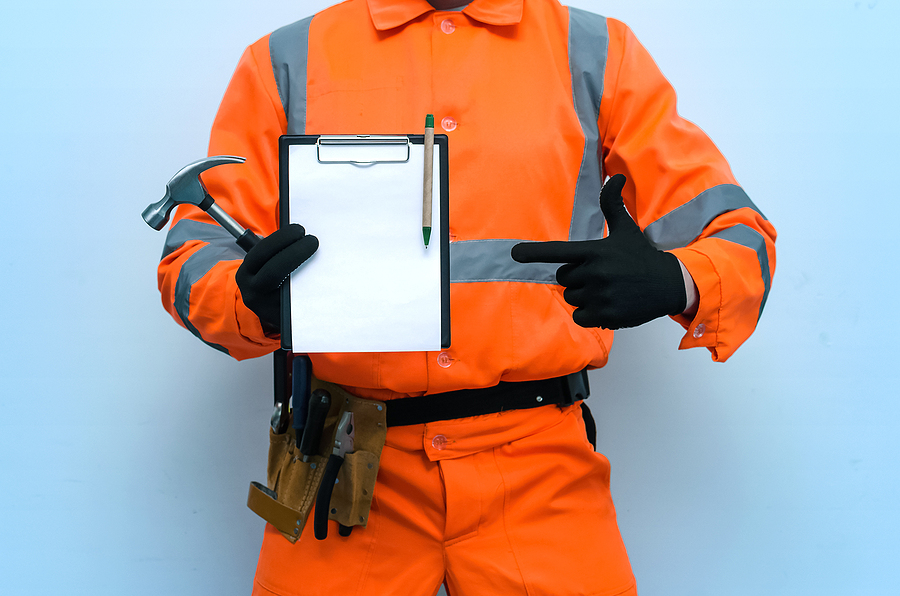 construction guy holding a clipboard