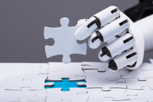 robotic hand placing final piece of jigsaw puzzle