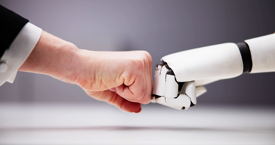 robot hand making fist bump with human hand