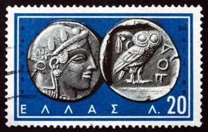 Greek postage stamp showing ancient coin of Athena and her symbol the wise owl